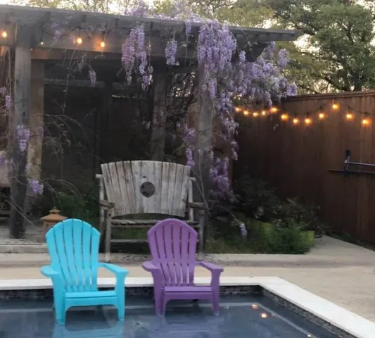 a wooden bench sitting in front of a building