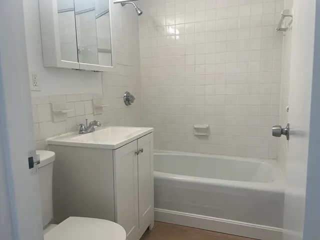 a room with lots of wooden cabinets