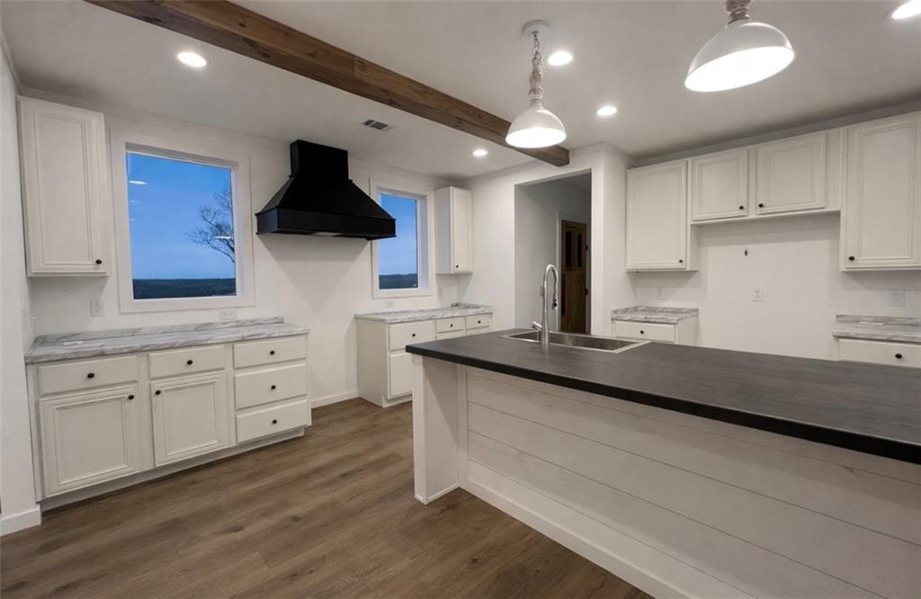 1590 Buttermilk Road Southwest Cave Spring, GA 30124 - Photo 19 of 43 a kitchen with granite countertop a sink and cabinets