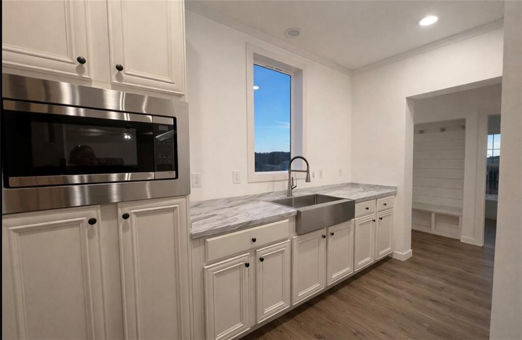 1590 Buttermilk Road Southwest Cave Spring, GA 30124 - Photo 20 of 43 a kitchen with stainless steel appliances granite countertop a sink and a microwave