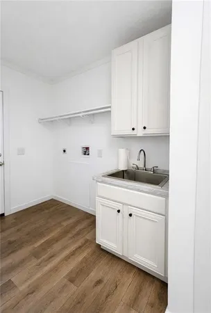a bathroom with a white tub shower and vanity