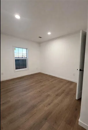 a view of a bathroom with wooden floor