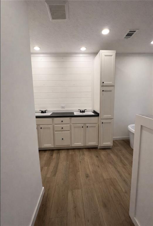 1590 Buttermilk Road Southwest Cave Spring, GA 30124 - Photo 30 of 43 a kitchen with sink cabinets and wooden floor