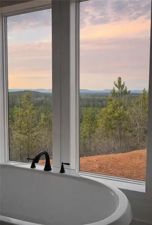 a bathroom with a bathtub and toilet