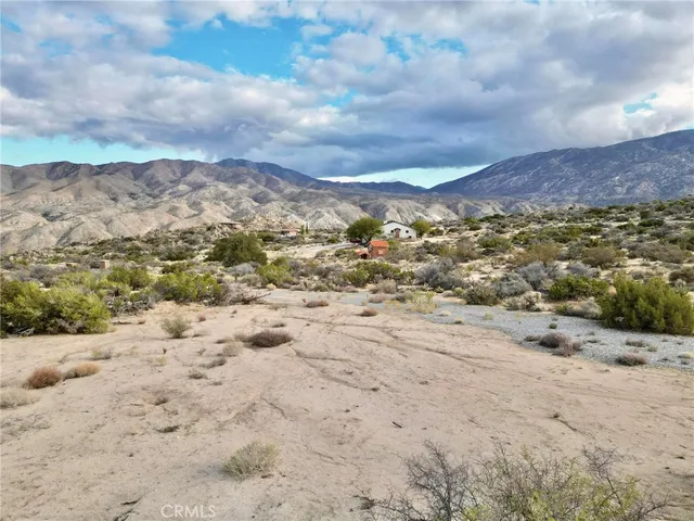 a view of mountains and city