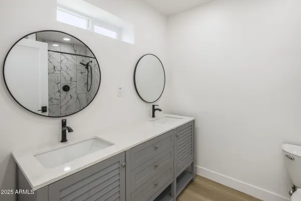a bathroom with a sink and mirror