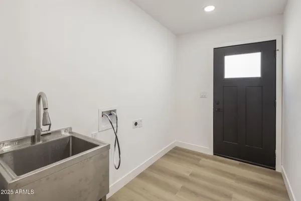 a bathroom with a sink and mirror
