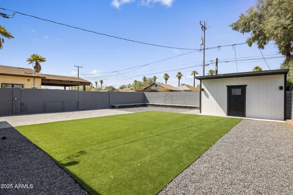 a view of a backyard with a small pool