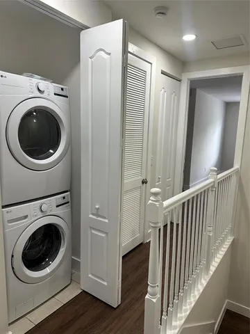 a view of a hallway with washer and dryer
