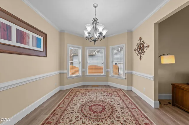 a kitchen with stainless steel appliances granite countertop a stove oven a sink dishwasher and cabinets with wooden floor