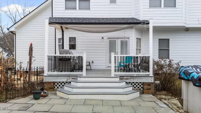 an aerial view of a house with garden space and street view