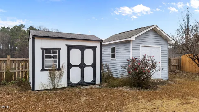 an aerial view of a house with outdoor space