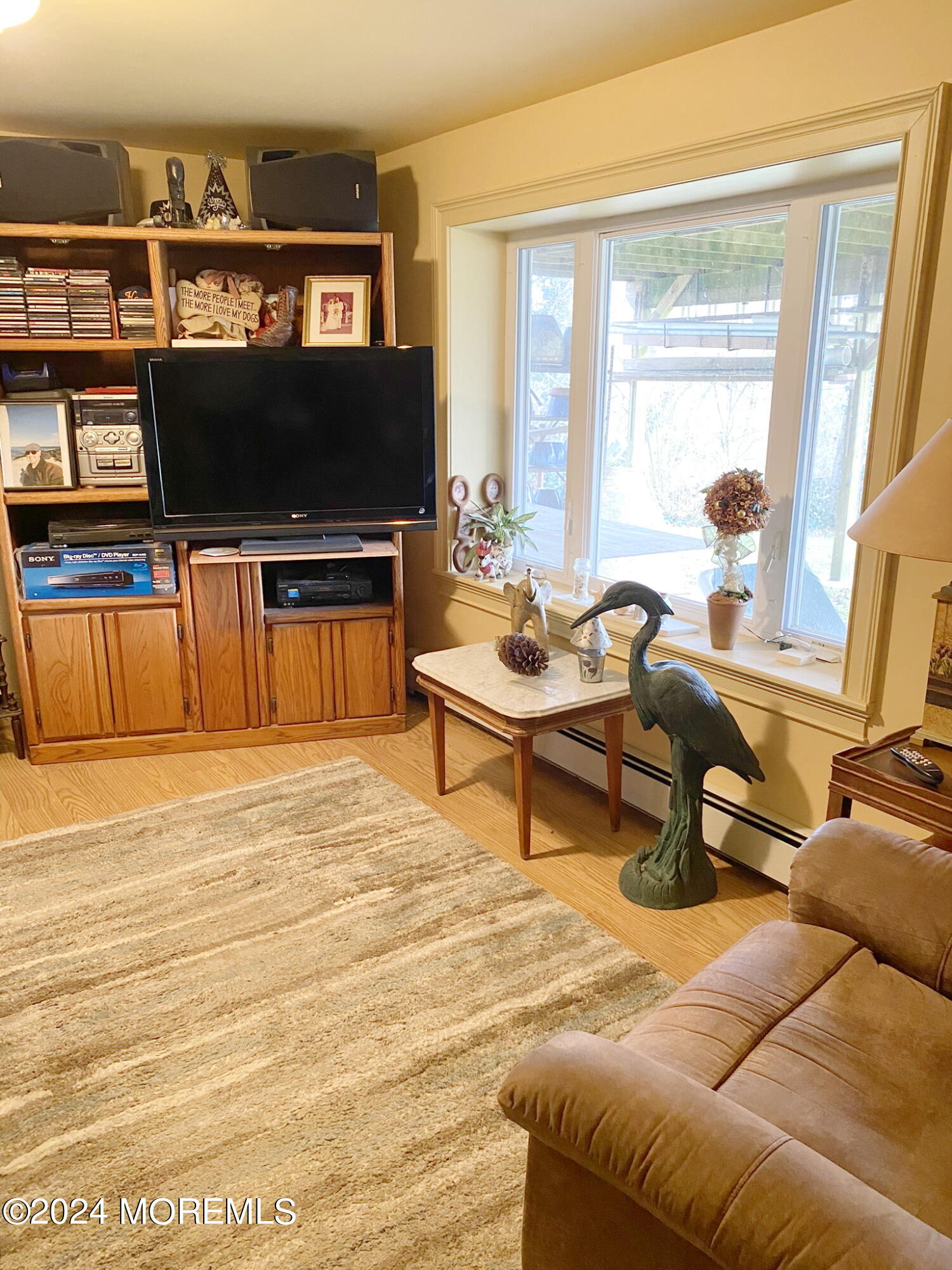 1621 Forge Pond Road Brick, NJ 08724 - Photo 23 of 29 a living room with furniture and a flat screen tv