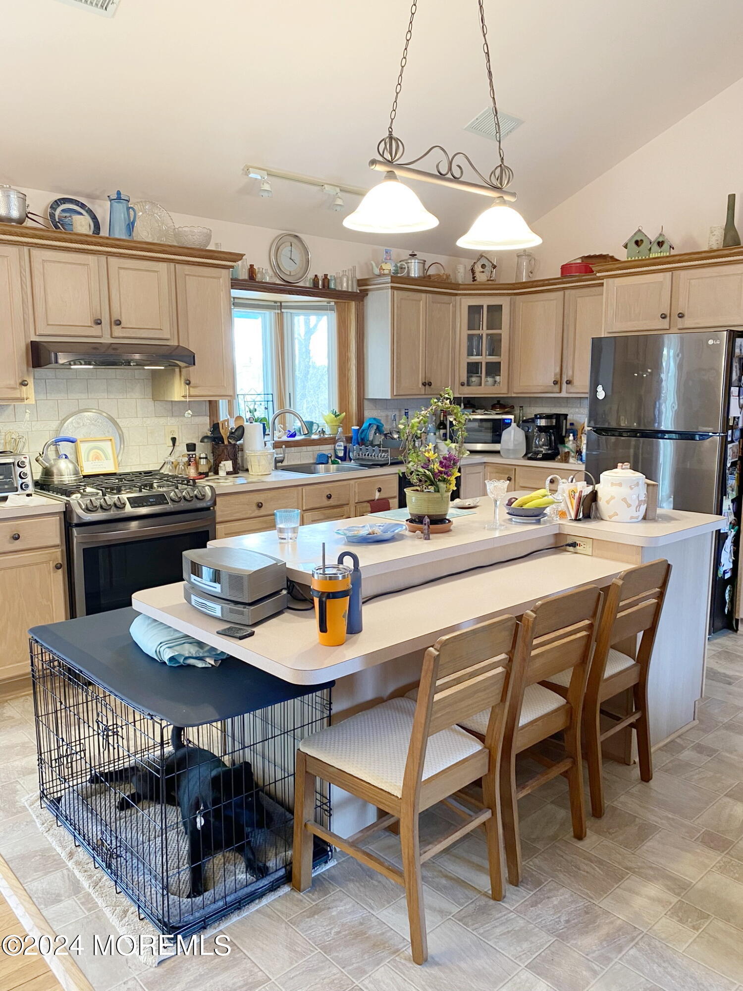 1621 Forge Pond Road Brick, NJ 08724 - Photo 7 of 29 a kitchen with a table chairs and a stove
