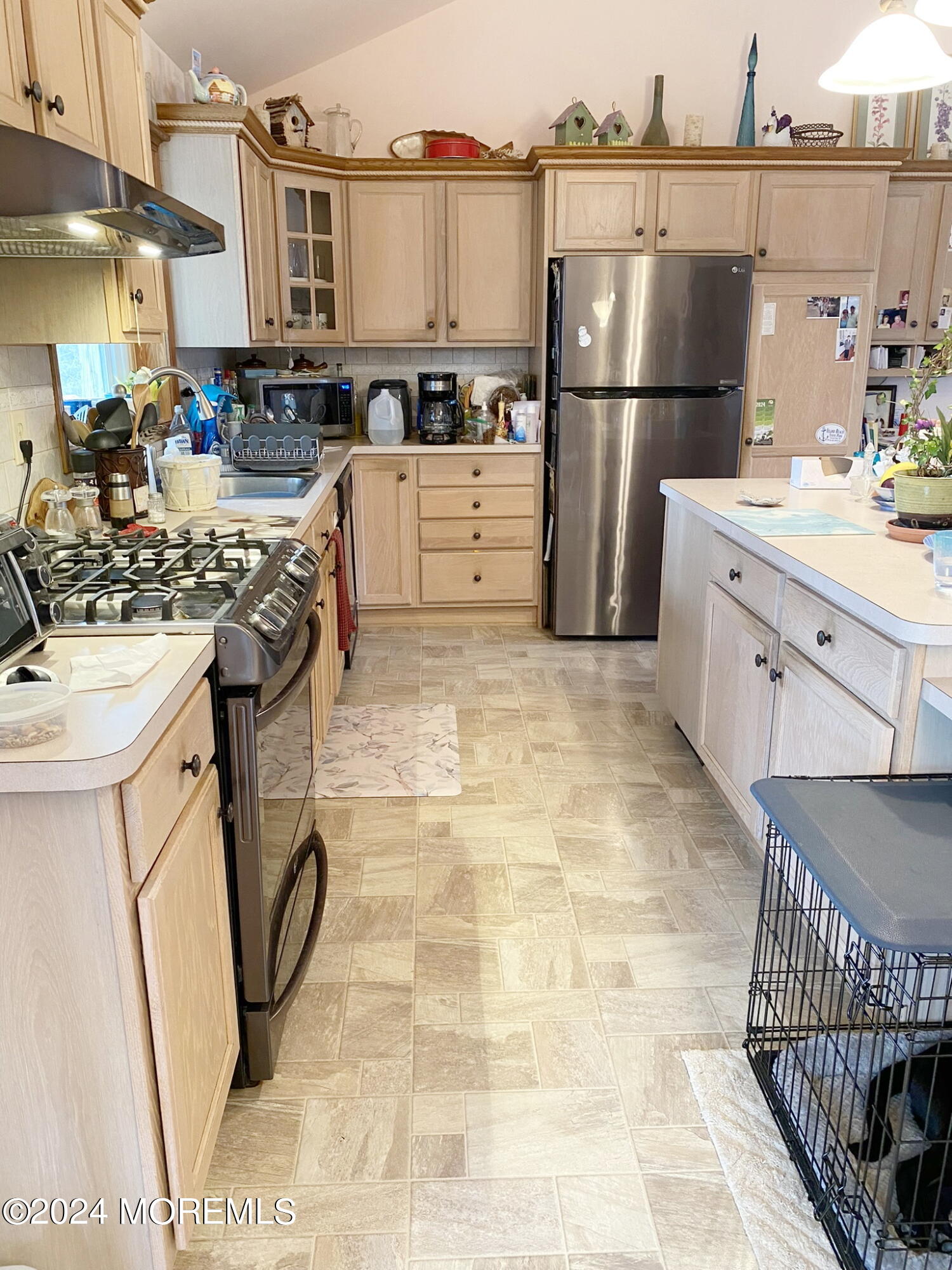 1621 Forge Pond Road Brick, NJ 08724 - Photo 10 of 29 a kitchen with stainless steel appliances a stove a sink and a refrigerator