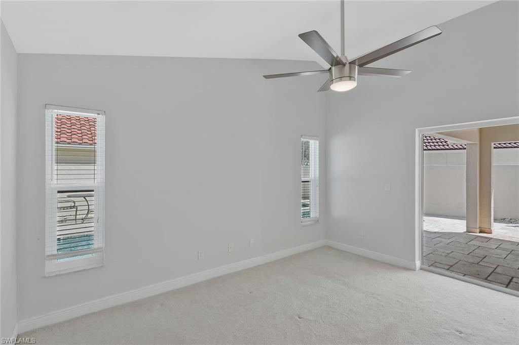 11054 Linnet Lane Naples, FL 34119 - Photo 21 of 50 an empty room with a window and a fan