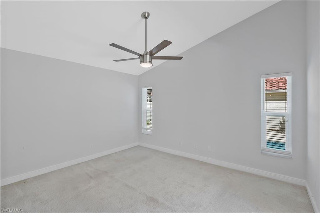 11054 Linnet Lane Naples, FL 34119 - Photo 23 of 50 an empty room with a window and a fan