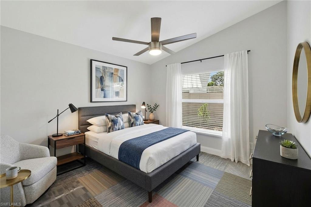 11054 Linnet Lane Naples, FL 34119 - Photo 30 of 50 a bedroom with a bed wooden floor and window