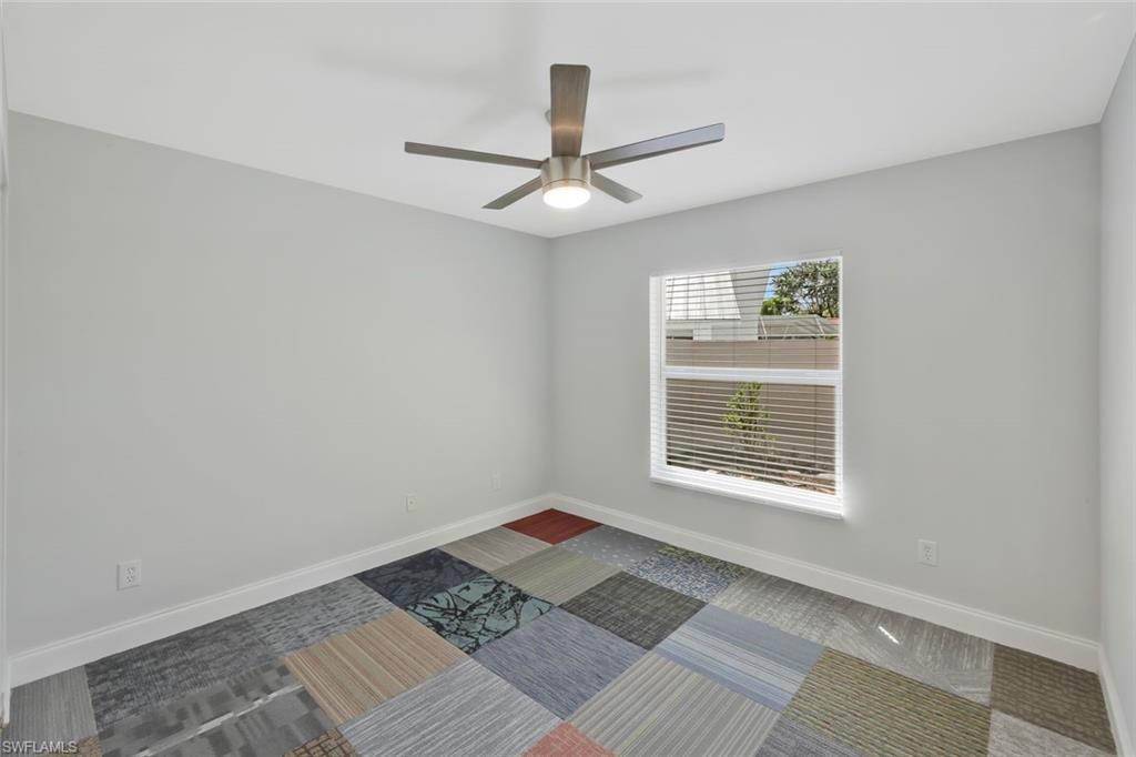 11054 Linnet Lane Naples, FL 34119 - Photo 31 of 50 a view of an empty room with a window