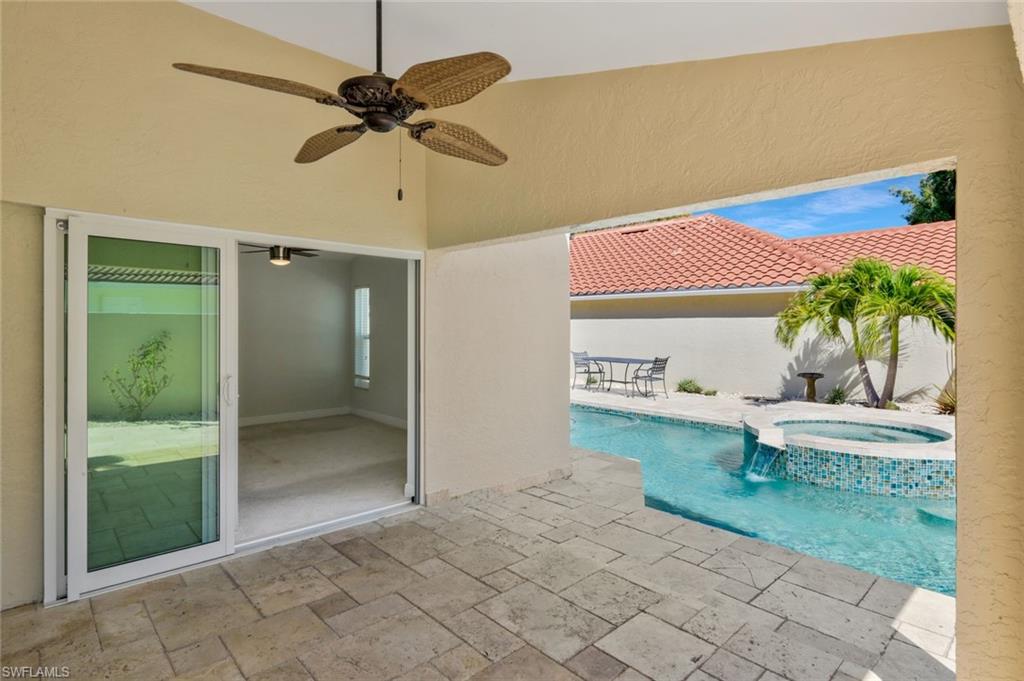 11054 Linnet Lane Naples, FL 34119 - Photo 34 of 50 a view of a patio with a table and chairs