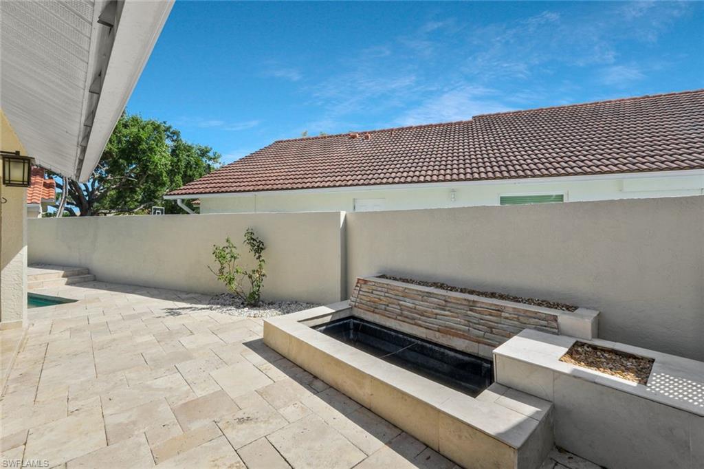 11054 Linnet Lane Naples, FL 34119 - Photo 37 of 50 a view of backyard with wooden wall