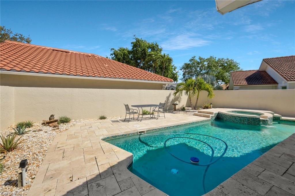 11054 Linnet Lane Naples, FL 34119 - Photo 39 of 50 a view of a backyard with plants and patio
