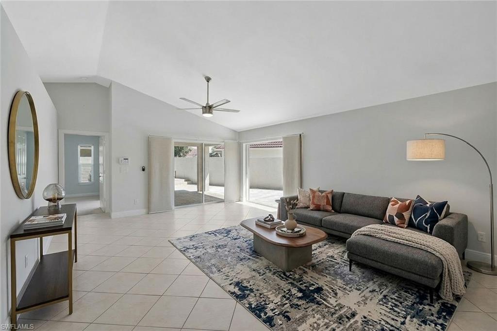 11054 Linnet Lane Naples, FL 34119 - Photo 6 of 50 a living room with furniture and wooden floor