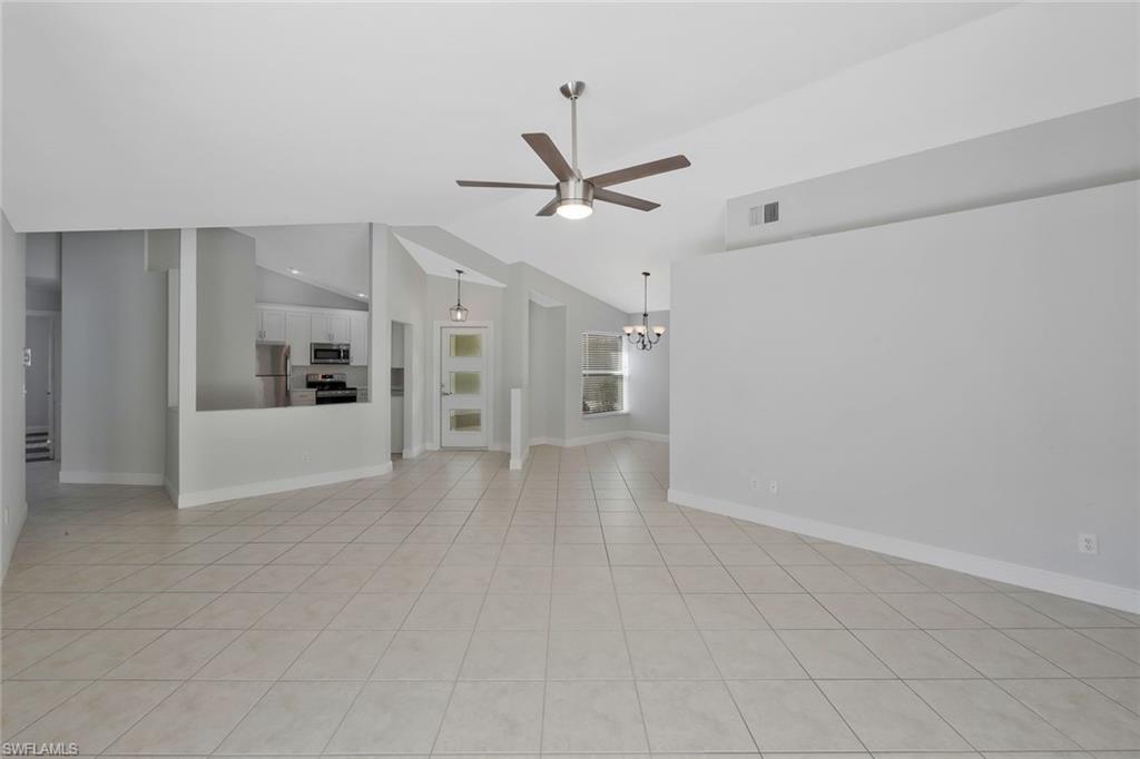 11054 Linnet Lane Naples, FL 34119 - Photo 50 of 50 wooden floor in an empty room with a window