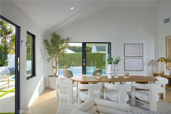 a view of a dining room with furniture window and outside view