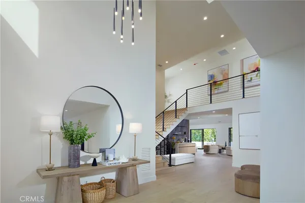 a lobby with furniture and a mirror