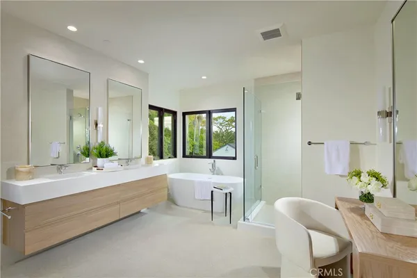 a bedroom with a bed and glass windows