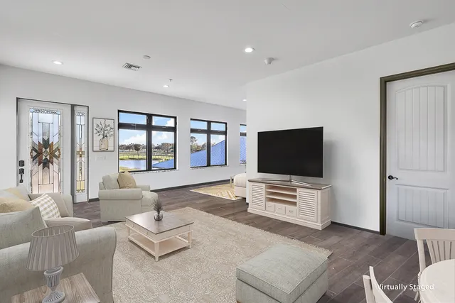 a bedroom view with a bed and wooden floor