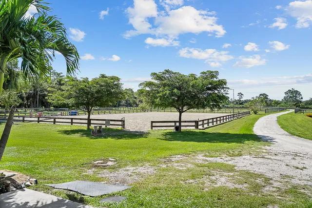 a view of a golf course with a lake view
