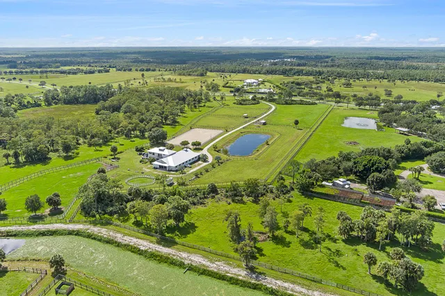 a view of swimming pool with seating area and roof