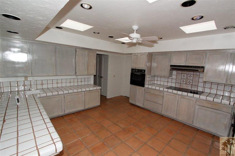 71371 Biskra Road Rancho Mirage, CA 92270 - Photo 26 of 39 a large white kitchen with a large window