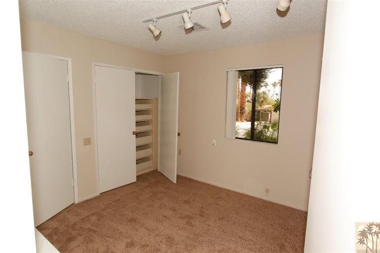 71371 Biskra Road Rancho Mirage, CA 92270 - Photo 28 of 39 a view of a hallway with wooden floor
