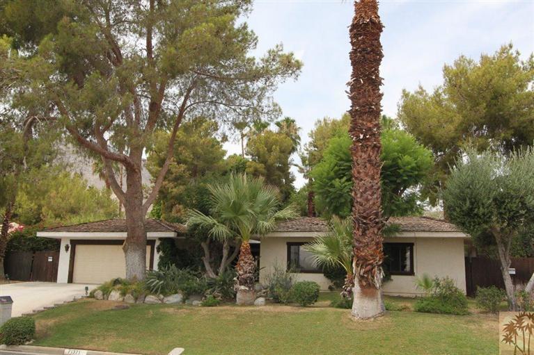 71371 Biskra Road Rancho Mirage, CA 92270 - Photo 3 of 39 a front view of a house with garden