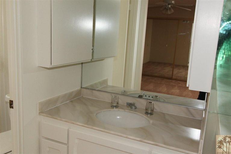 71371 Biskra Road Rancho Mirage, CA 92270 - Photo 39 of 39 a bathroom with a sink and a mirror