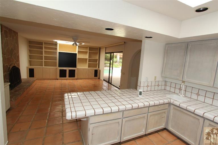 71371 Biskra Road Rancho Mirage, CA 92270 - Photo 4 of 39 a bedroom with a large bed and a flat screen tv