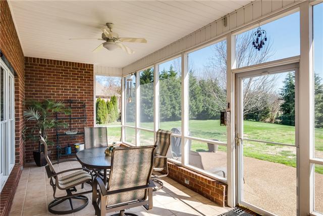 1475 Ridley Drive Franklin, TN 37064 - Photo 19 of 20 Screened porch with tile floor is perfect for having dinner. 2 year old grill with natural gas hookup remains if buyer wants it to.