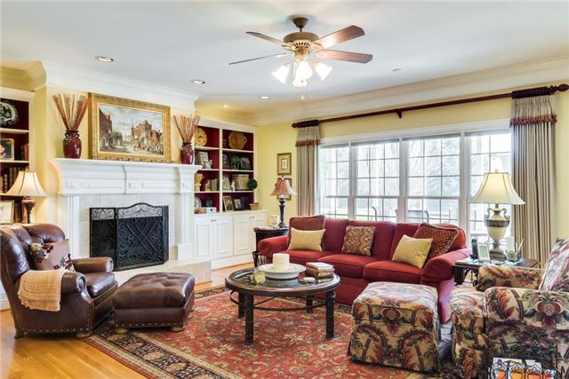 1475 Ridley Drive Franklin, TN 37064 - Photo 20 of 20 Open floor plan. Bright great room has a wall of windows overlooking lush back yard. Fireplace with gas logs, built in bookcases, custom window treatments and shades.