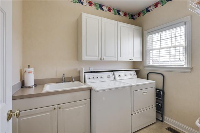 1475 Ridley Drive Franklin, TN 37064 - Photo 9 of 20 Large laundry room with sink is 9x7.