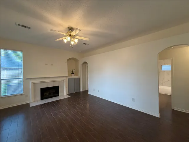 a kitchen with a sink and white cabinets