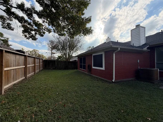 a backyard of a house with lots of green space