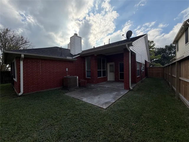 a view of house with yard