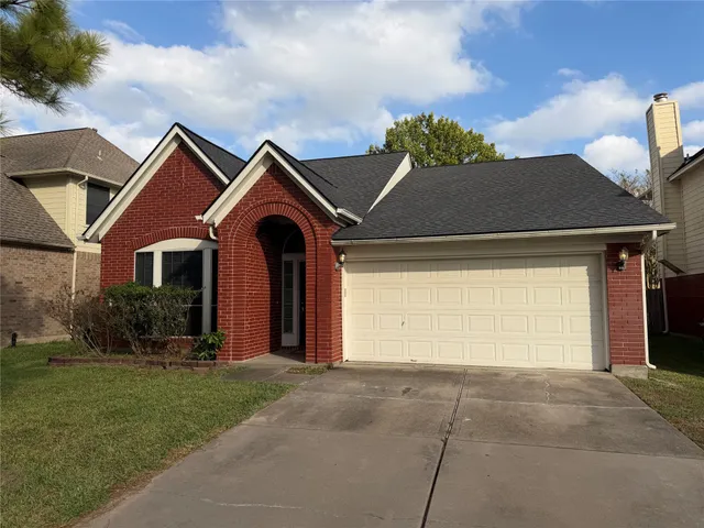 a backyard of a house with garage