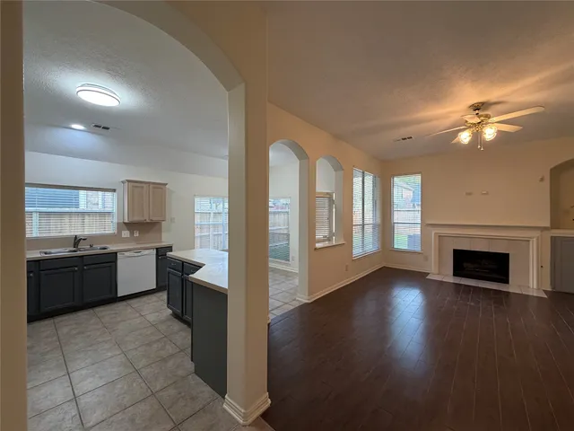 a large kitchen with stainless steel appliances granite countertop a stove and a refrigerator