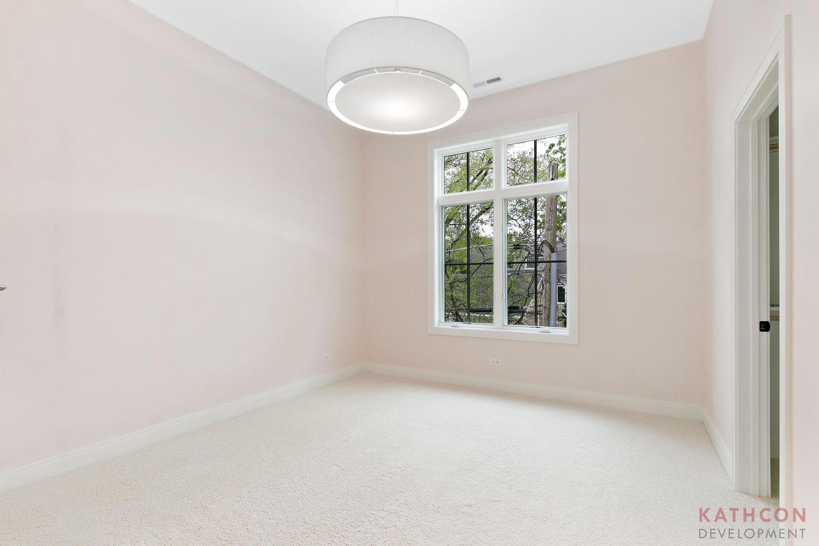 650 Sanders Road Northbrook, IL 60062 - Photo 9 of 24 an empty room with a window