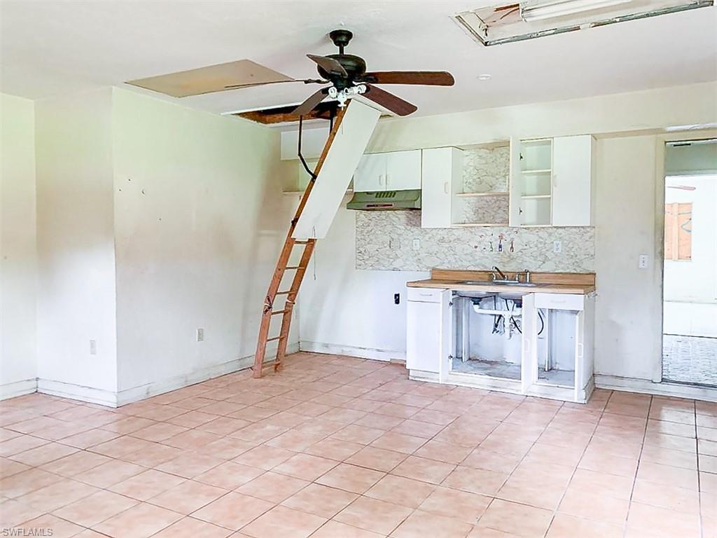5975 Green Boulevard Naples, FL 34116 - Photo 11 of 20 a view of a room with a table and chairs