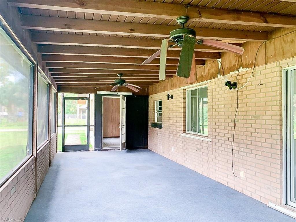 5975 Green Boulevard Naples, FL 34116 - Photo 16 of 20 a view of an empty room with a window